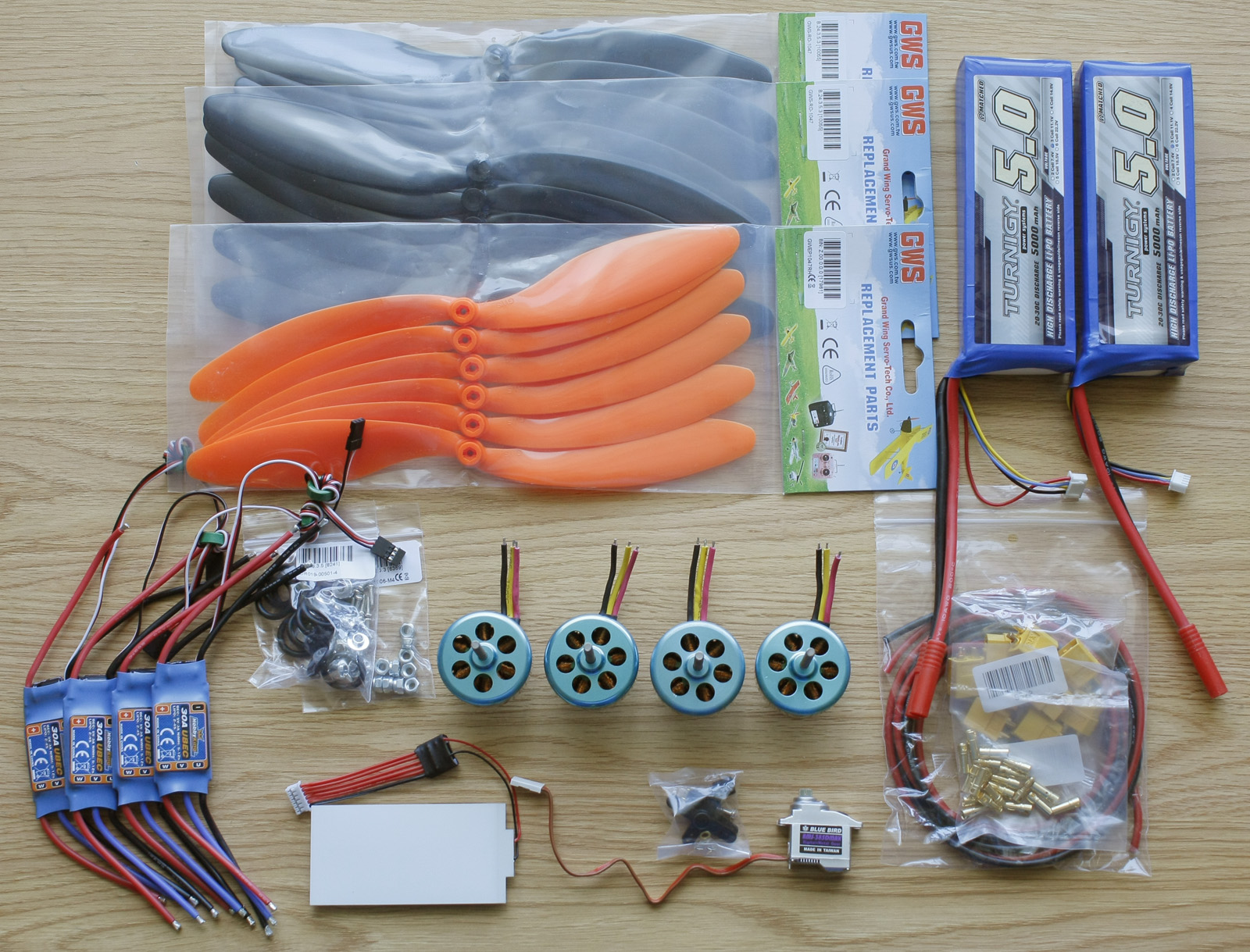 Main HobbyKing order containing batteries, motors, ESCs, servo, props, and accessories